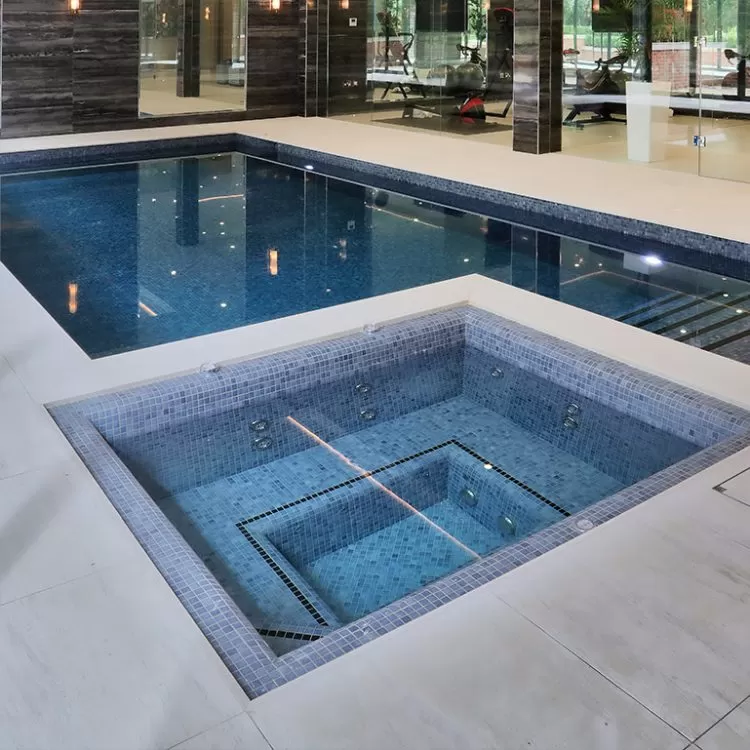 Geometric pool with custom spa pool with seating