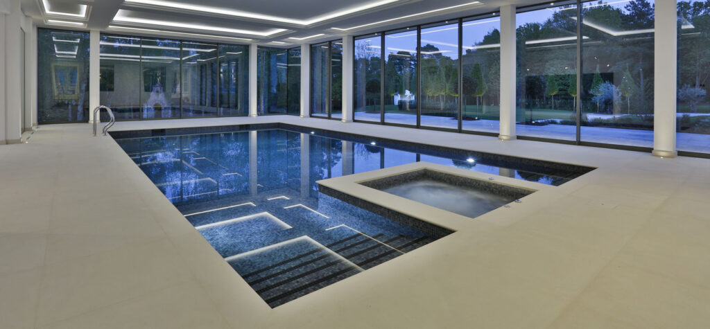 Indoor Falcon Pool with a custom spa pool area