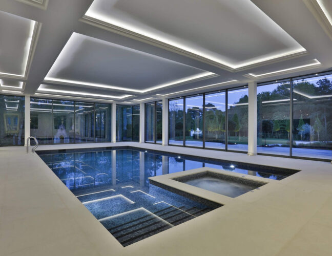 Luxury indoor Falcon Pool with shaded iron blue pool finishing