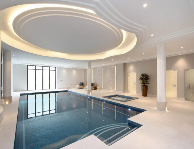 Luxury Indoor Falcon Pool with Roman steps and inground spa pool