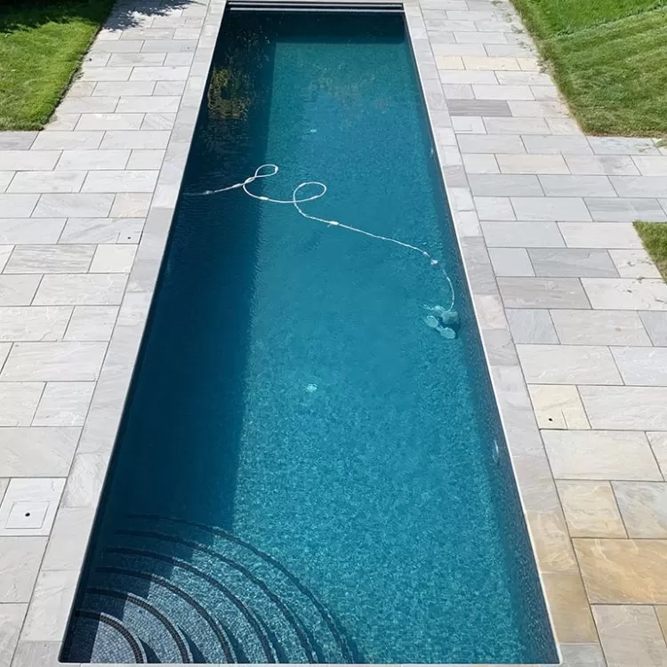 Outdoor Exercise Lap Pool With Pool Cleaning Equipment In