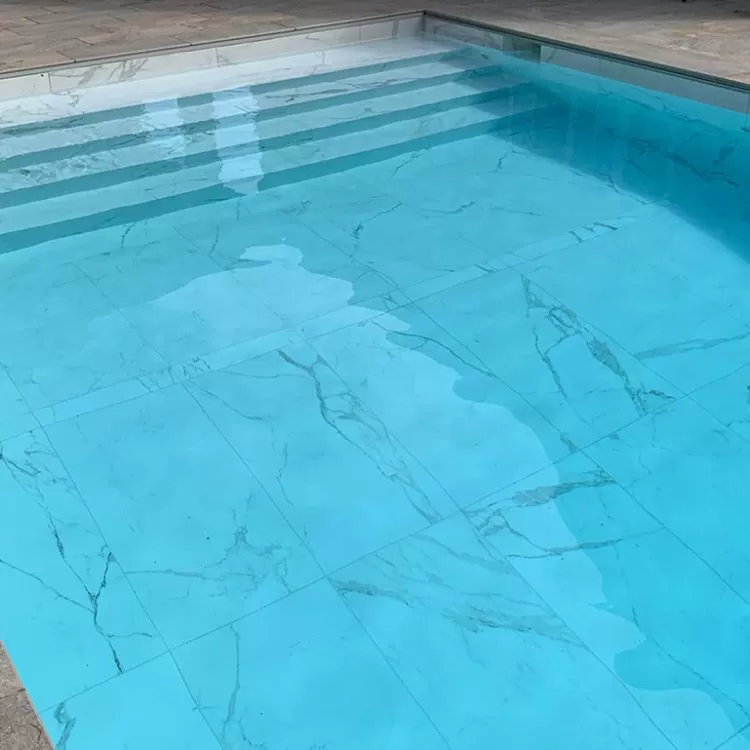 Outdoor Falcon Pool with marble style tiled bottom