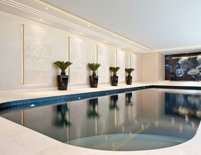 Luxury indoor pool with Metal mosaic pool finishing in Lava